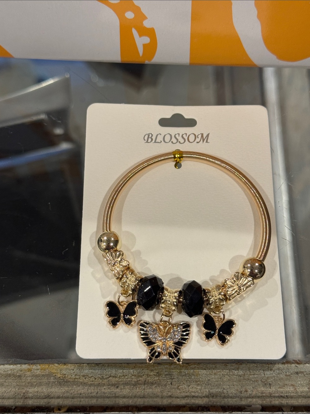 Blossom Gold Bracelet with Black Butterfly Accents